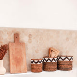 Brown woven banana fibre basket with zigzag pattern