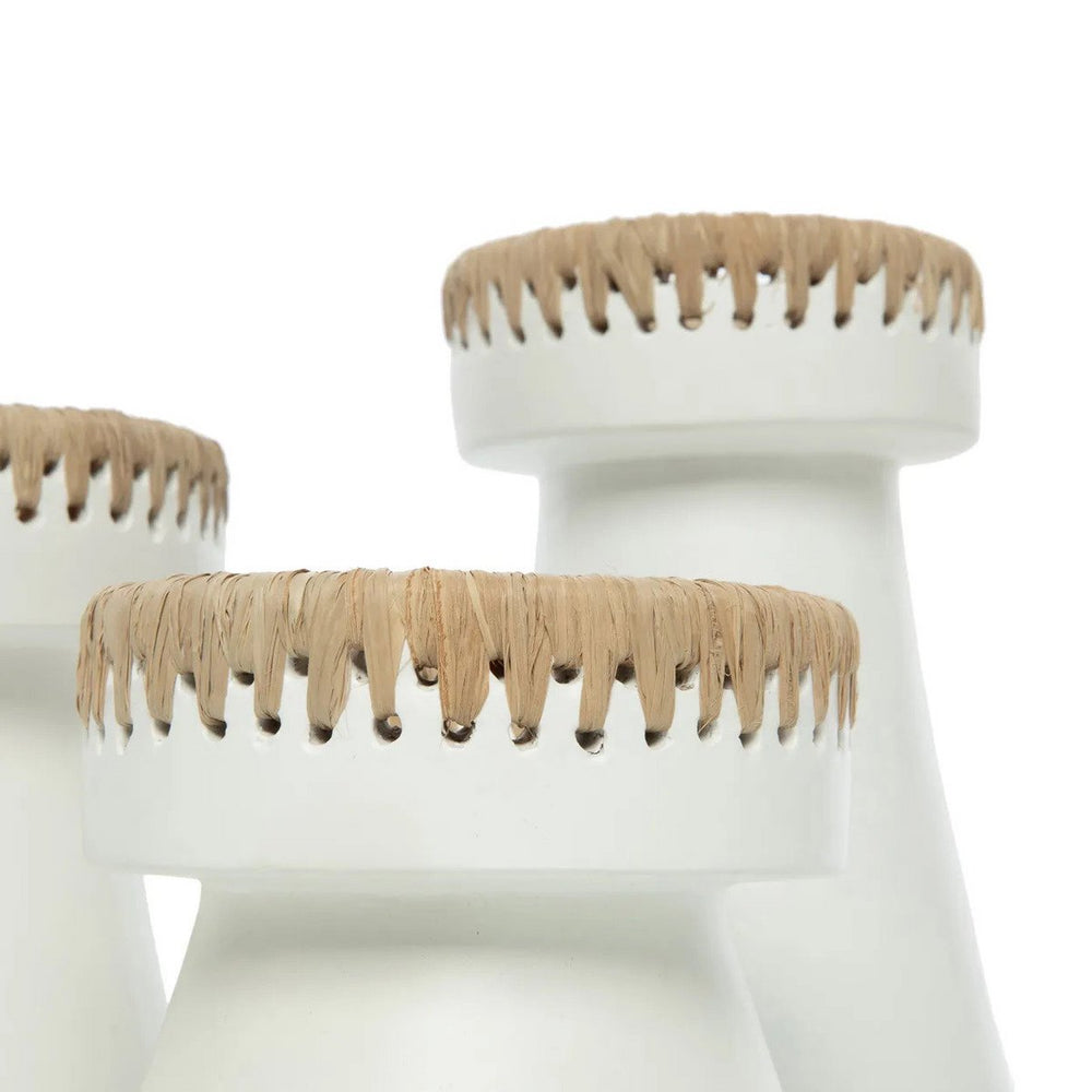 White stools with beige top rims on a white background