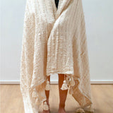 Beige handwoven cotton blanket with striped weave