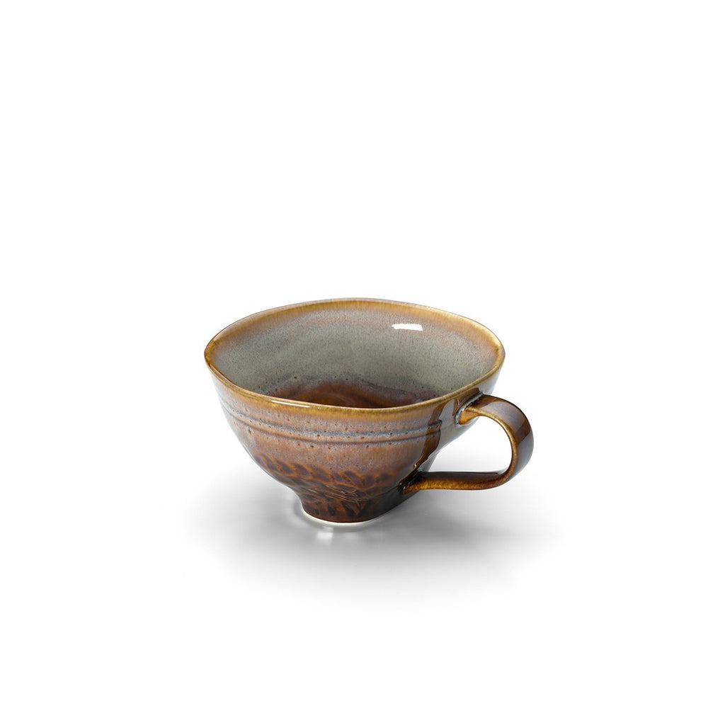 Ceramic cup with brown and gray glaze on a white background
