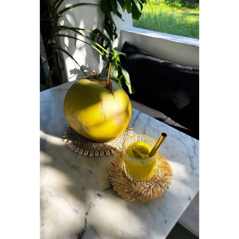 Natural raffia coaster with fringed edge