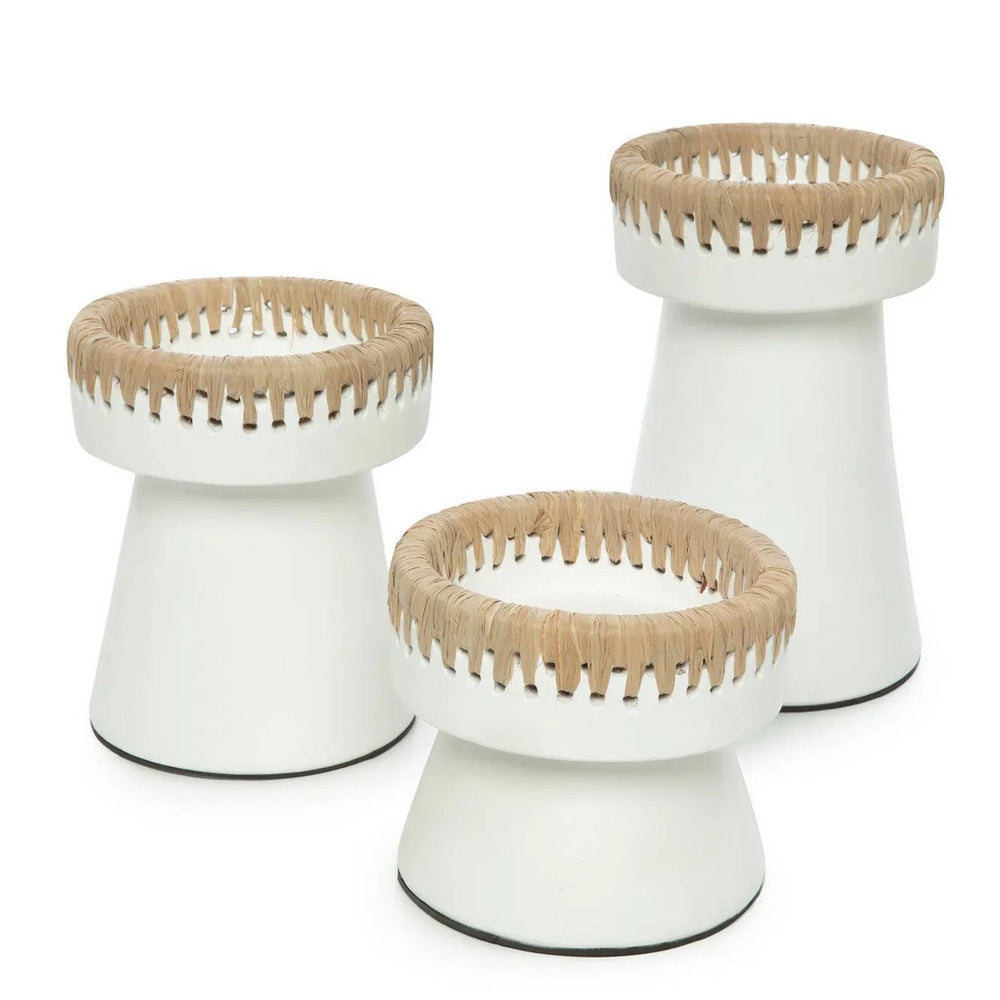 Three white stools with woven top sections on a white background