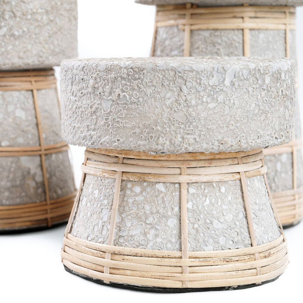 Decorative stone and wicker table on a white background