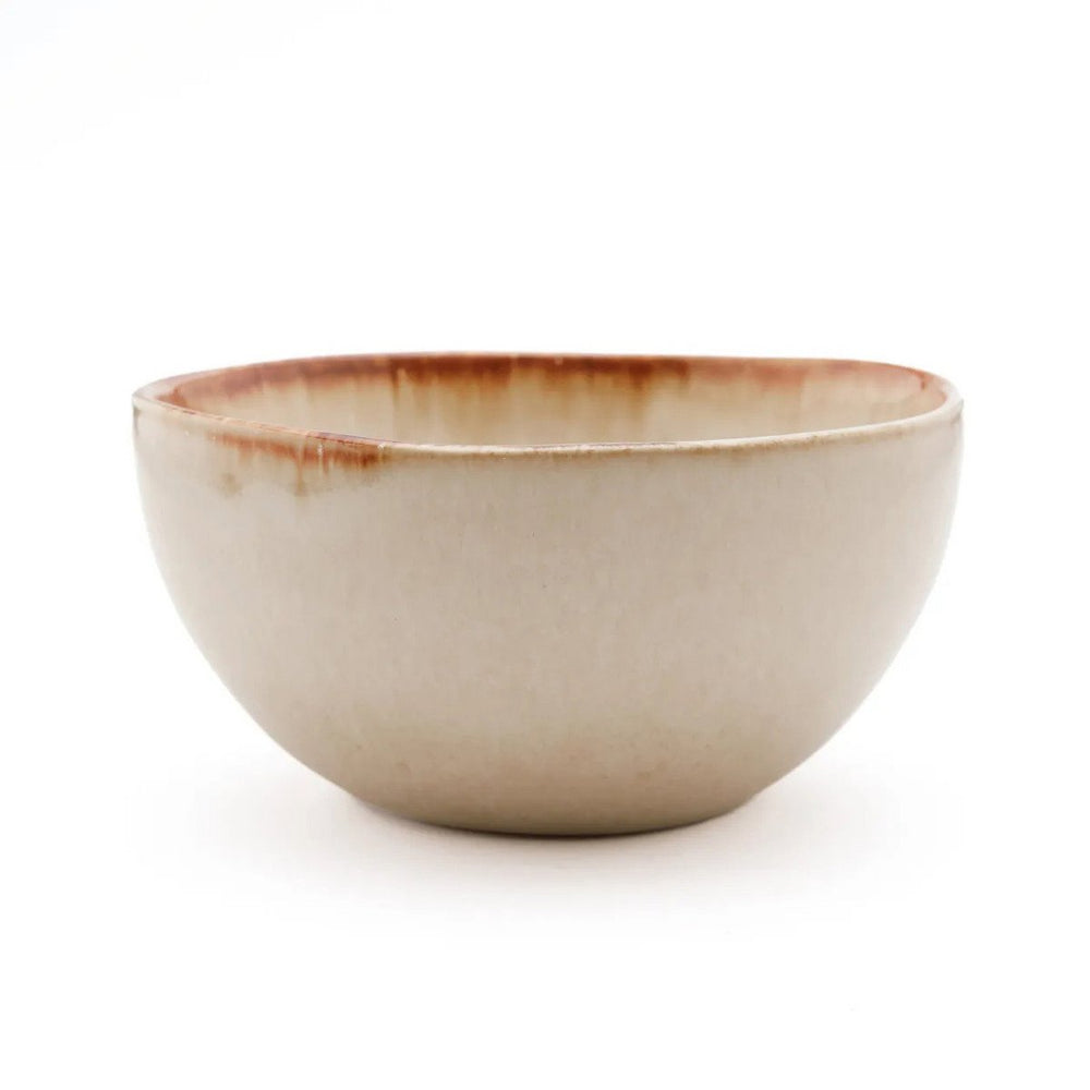 White stoneware cereal bowl with cinnamon-toned drip glaze