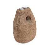 Rustic stone-like candle holder with a small candle inside on a white background