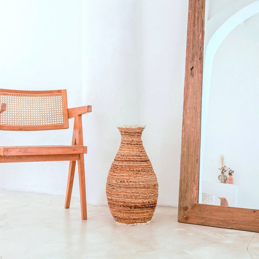 Beige and brown handwoven banana fiber vase with raffia accents