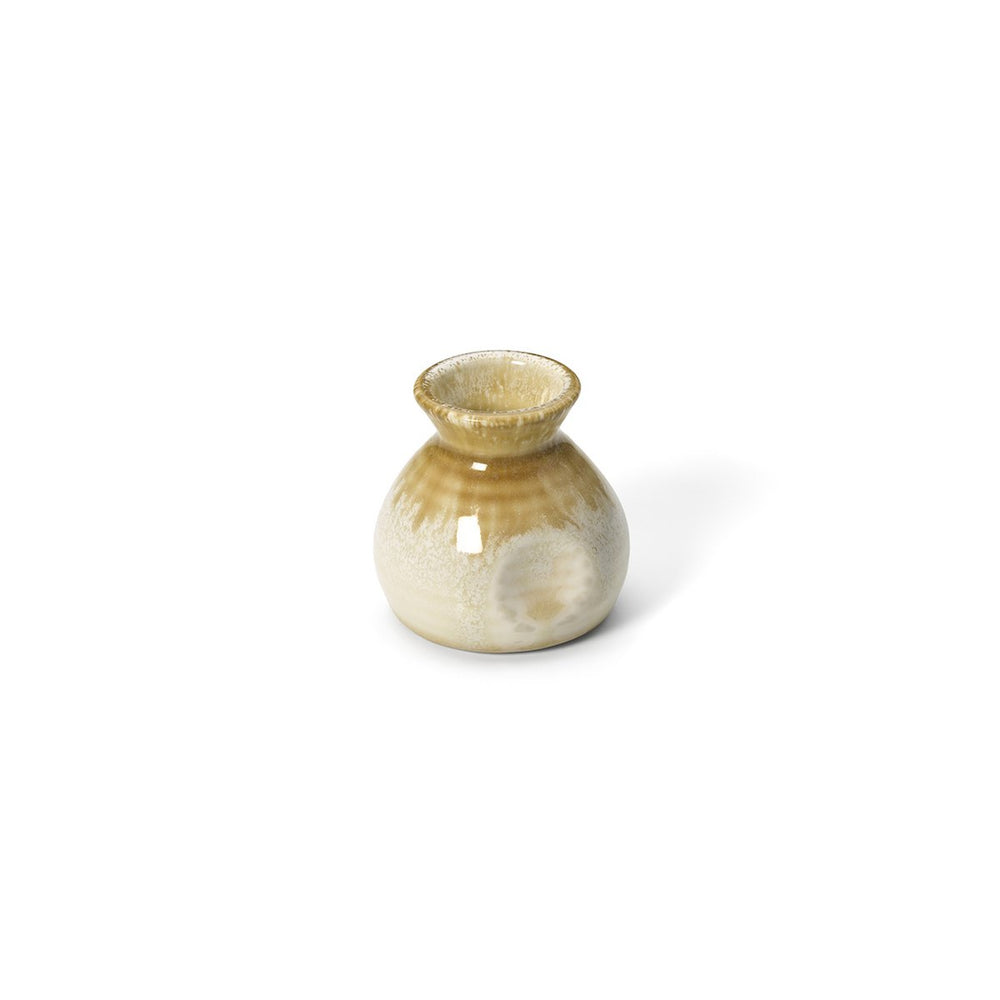 Beige ceramic sauce pourer with white honey glaze