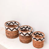 Brown woven banana fibre basket with zigzag pattern