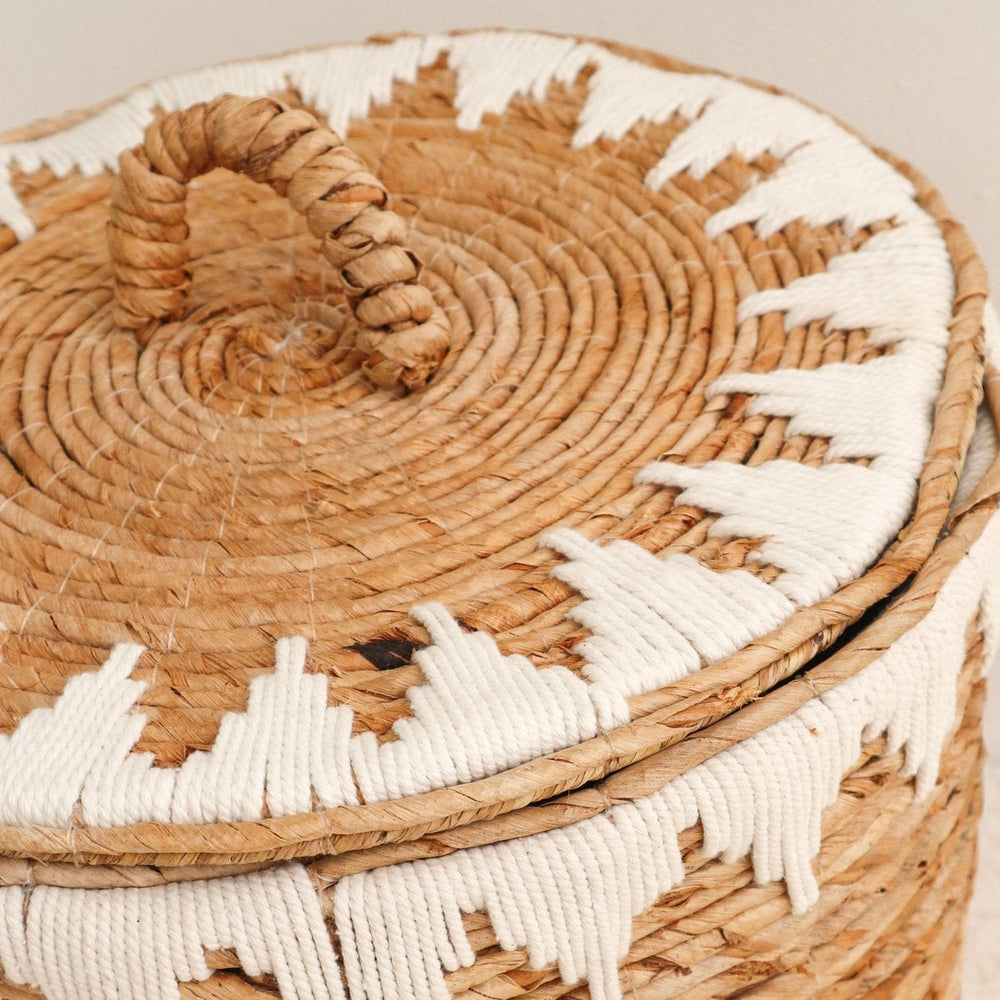 Brown woven banana fibre laundry basket with lid and white cotton macrame pattern