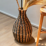 Black and natural woven water hyacinth vase