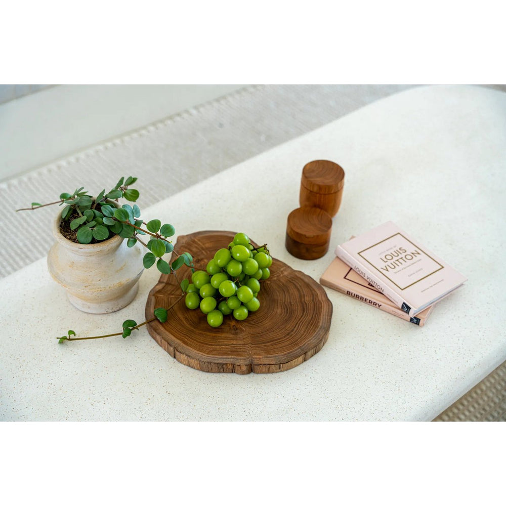 Brown teak wood cutting board with natural root shape