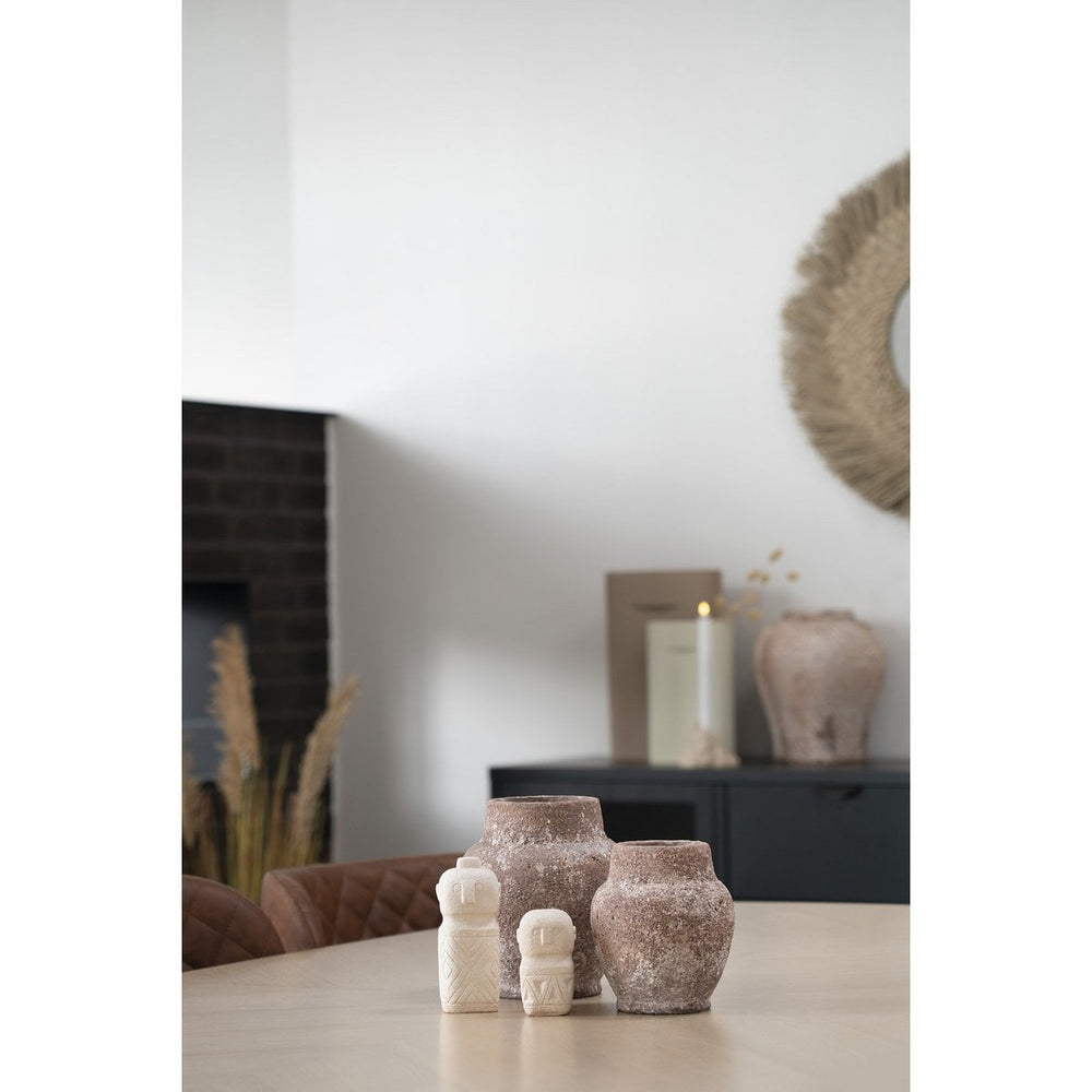 Decorative vases on a table with a neutral background