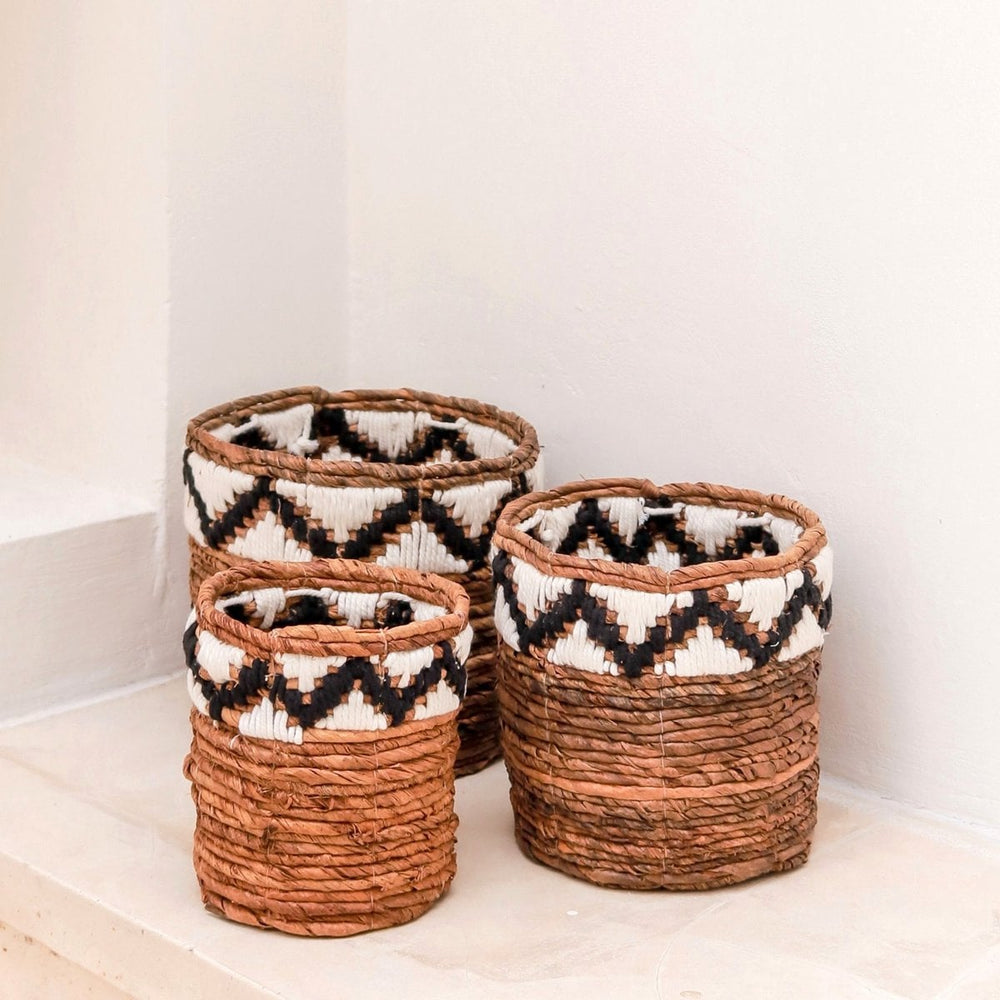 Brown woven banana fibre basket with zigzag pattern