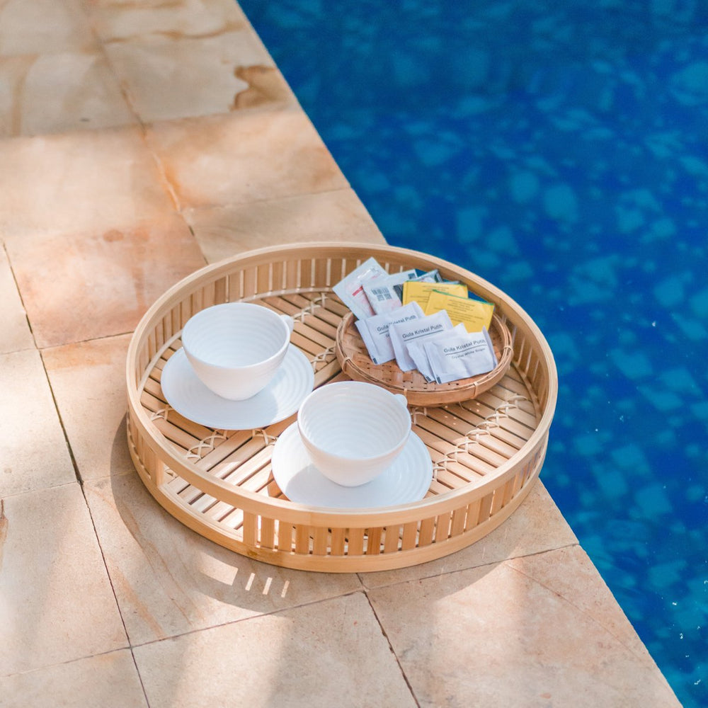 Beige round bamboo serving tray
