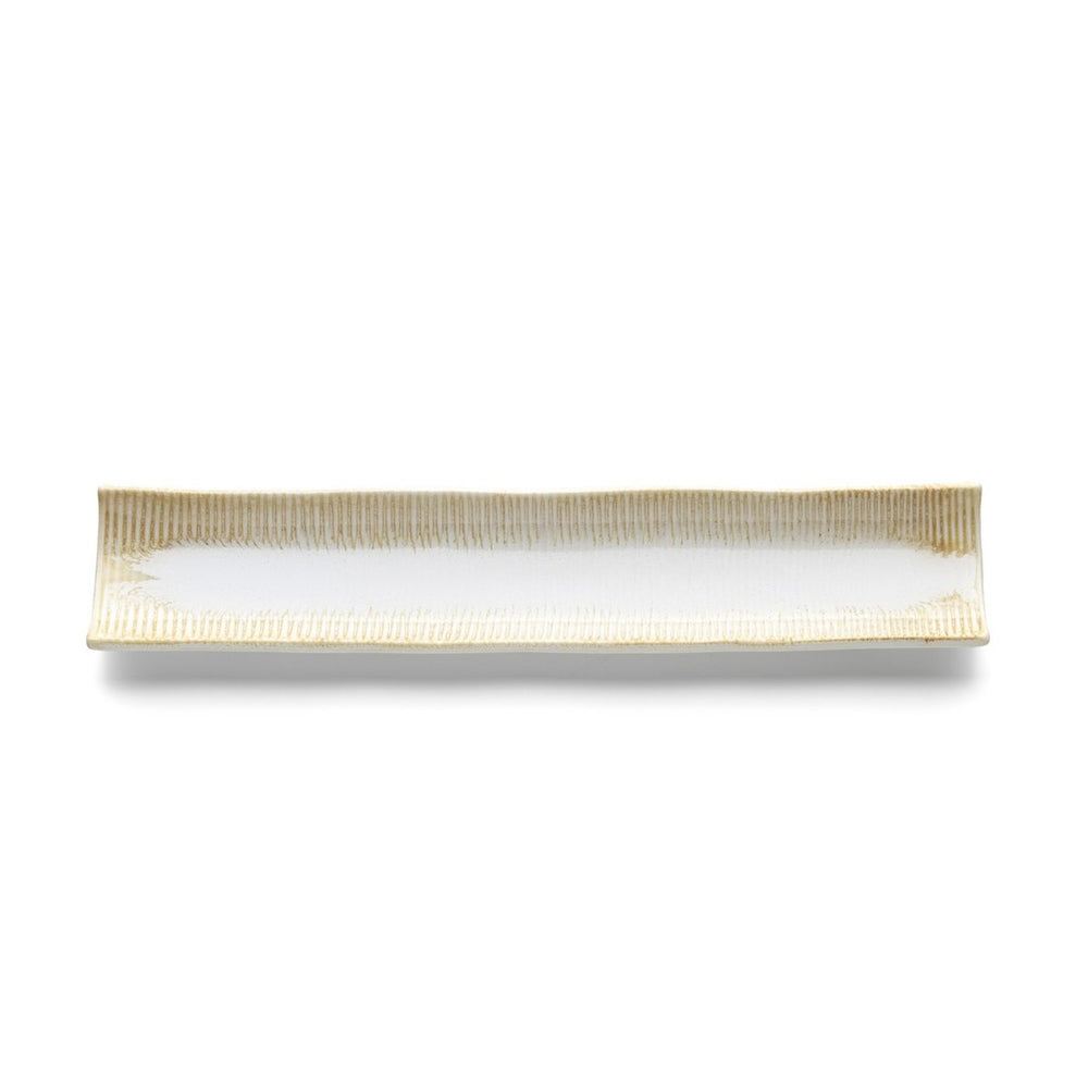 Beige long ceramic platter with white honey glaze