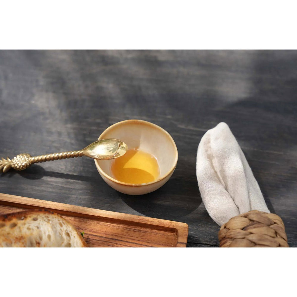 White stoneware sauce bowl with amber rim