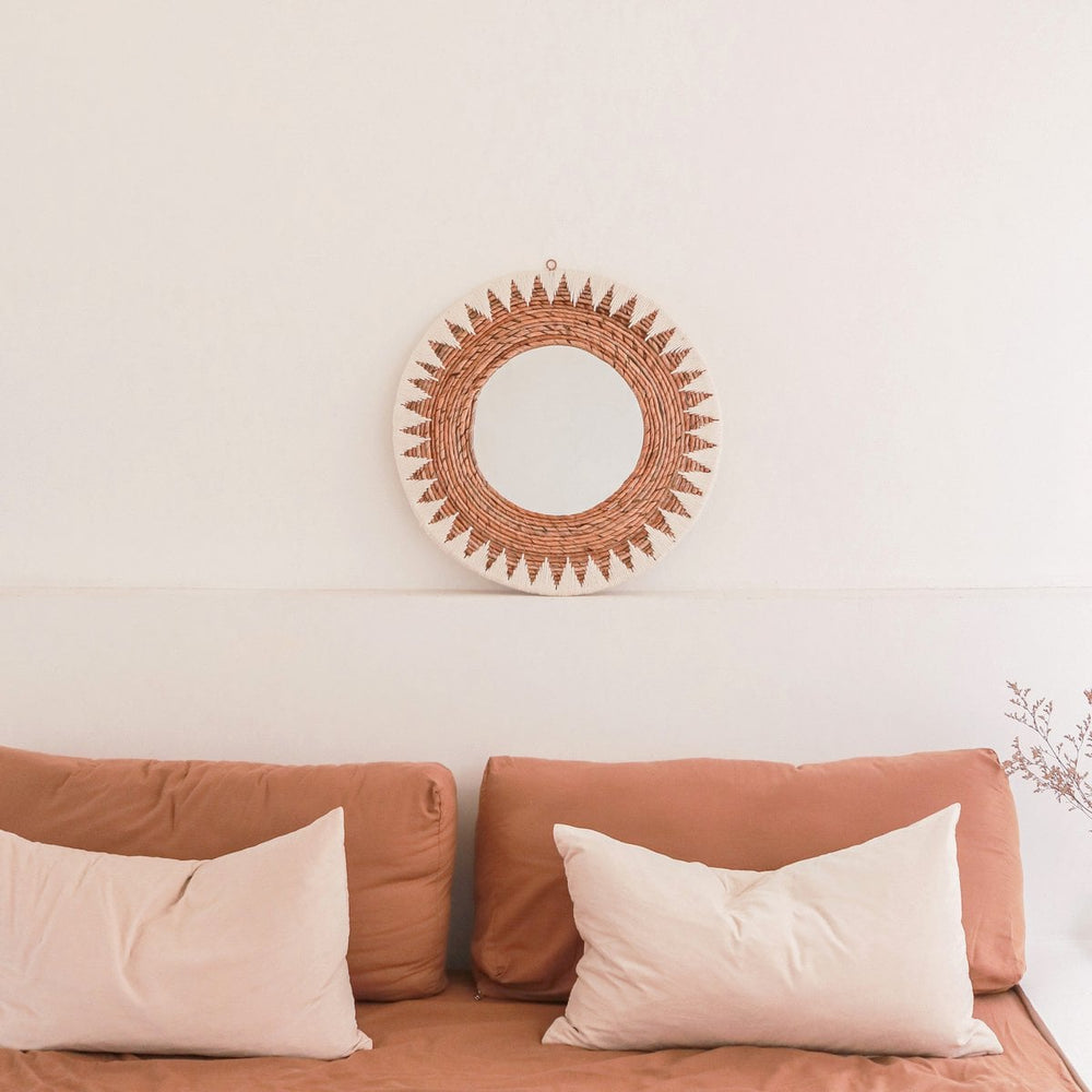 Round woven banana fibre wall mirror with white cotton pattern