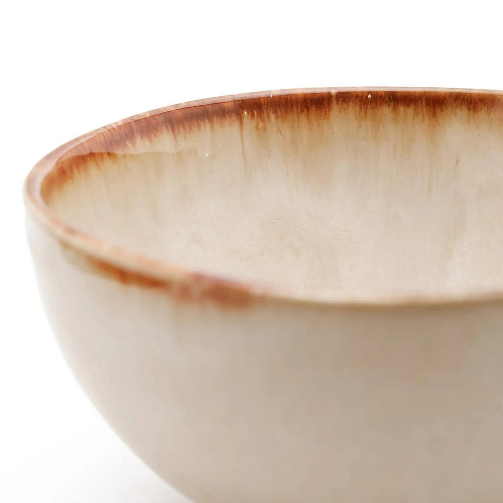 White stoneware cereal bowl with cinnamon-toned drip glaze