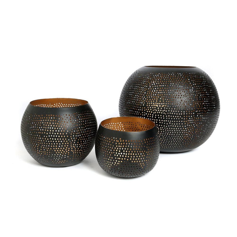 Black and gold pierced brass candle holder
