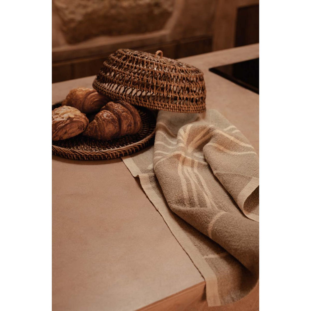 Natural white linen kitchen towel with palm tree print