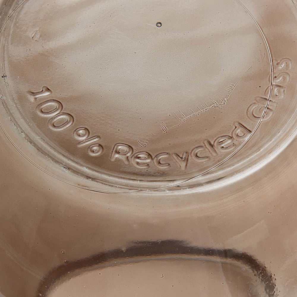Close-up of a glass container lid with '100% Recycled Glass' text.
